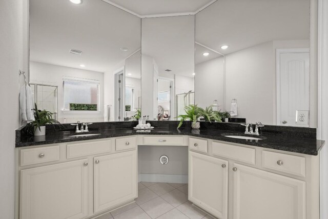728 Pioneer Grv, Round Rock, TX 78665 - bathroom featuring a shower stall, tile patterned floors, and vanity
