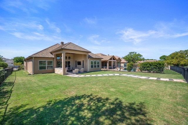 109 Grand Oaks Ln, Georgetown, TX 78628 - back of house featuring a fenced backyard, stucco siding, a patio area, a tiled roof, and a chimney