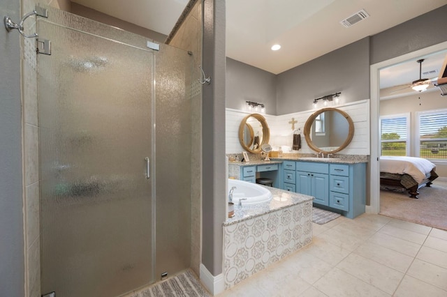 109 Grand Oaks Ln, Georgetown, TX 78628 - bathroom with a stall shower, vanity, tile patterned flooring, backsplash, and a garden tub