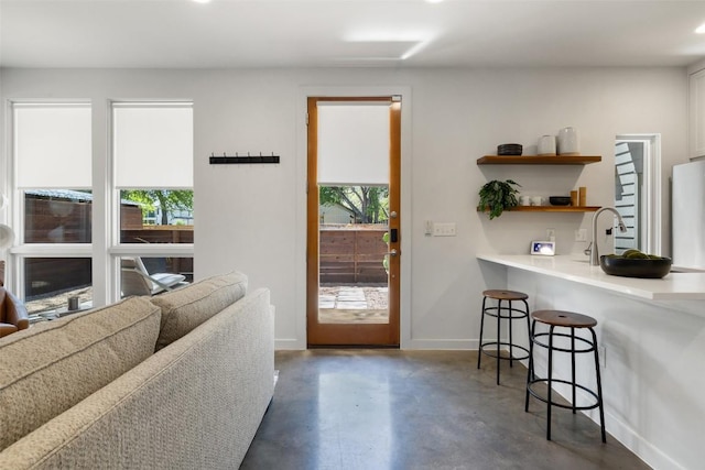 1605 Willow St Unit B, Austin, TX 78702 - entryway with concrete floors, baseboards, and a sink