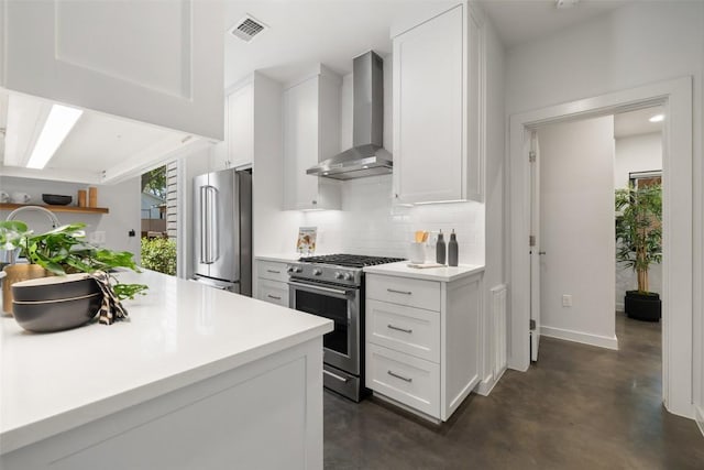 1605 Willow St Unit B, Austin, TX 78702 - kitchen with stainless steel appliances, backsplash, visible vents, concrete flooring, and wall chimney exhaust hood