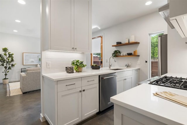 1605 Willow St Unit B, Austin, TX 78702 - kitchen with finished concrete flooring, appliances with stainless steel finishes, decorative backsplash, and a sink