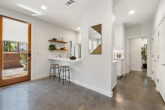1605 Willow St Unit B, Austin, TX 78702 - corridor featuring recessed lighting, baseboards, visible vents, and finished concrete flooring