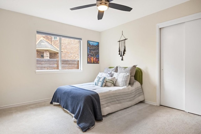 7306 Holly Fern Cv, Austin, TX 78750 - carpeted bedroom with a ceiling fan and a closet