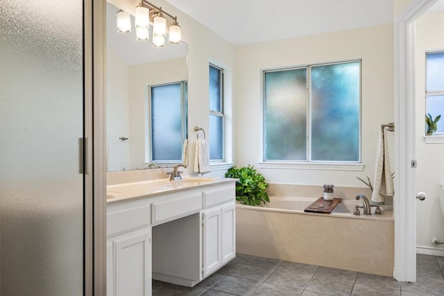 7306 Holly Fern Cv, Austin, TX 78750 - full bathroom featuring vanity, a bath, and tile patterned flooring