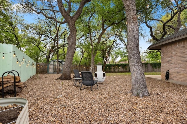 7306 Holly Fern Cv, Austin, TX 78750 - fenced backyard featuring an outdoor structure and an exterior structure