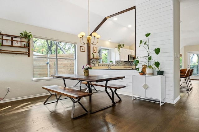 7306 Holly Fern Cv, Austin, TX 78750 - dining space featuring dark wood-type flooring, a chandelier, recessed lighting, and vaulted ceiling