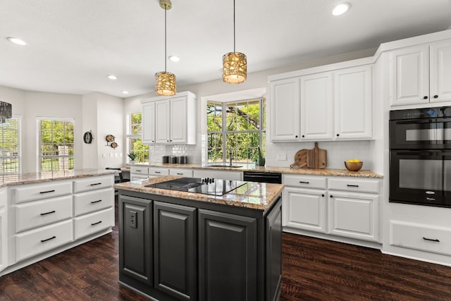 6 Dovedale Cv, The Hills, TX 78738 - kitchen with black appliances, dark wood-style floors, backsplash, white cabinets, and plenty of natural light