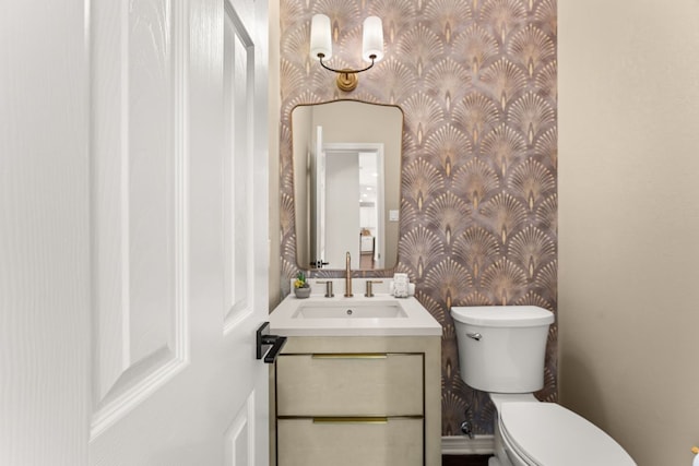6 Dovedale Cv, The Hills, TX 78738 - bathroom with wallpapered walls and vanity
