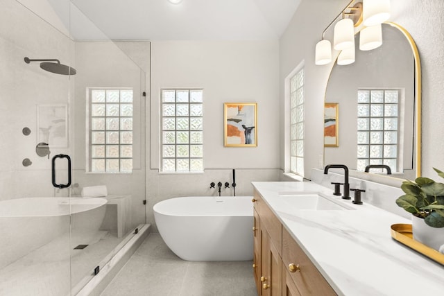 6 Dovedale Cv, The Hills, TX 78738 - full bathroom with a stall shower, vanity, and a soaking tub