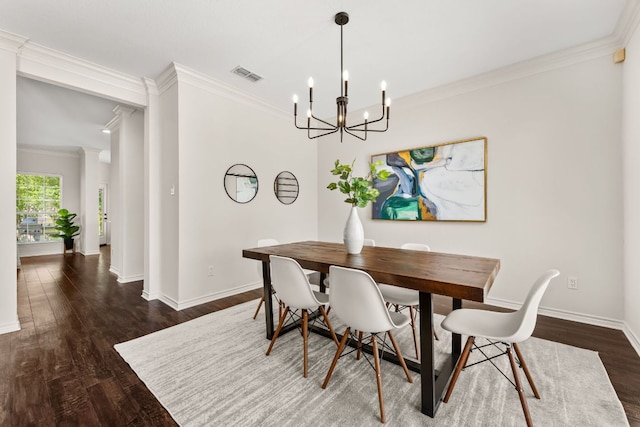 6 Dovedale Cv, The Hills, TX 78738 - dining room featuring a chandelier, ornamental molding, and dark wood-type flooring