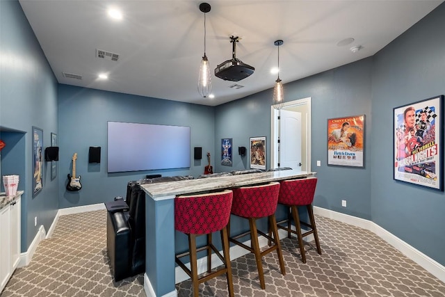 212 Bella Cima Dr, Austin, TX 78734 - home theater room featuring dark colored carpet, a dry bar, and recessed lighting