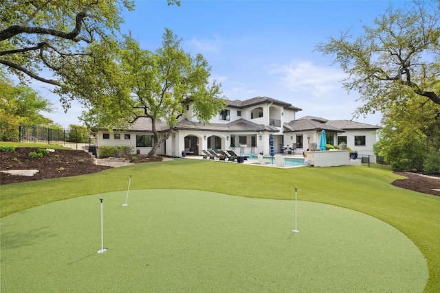 212 Bella Cima Dr, Austin, TX 78734 - view of home's community with a putting green, a swimming pool, and a patio area