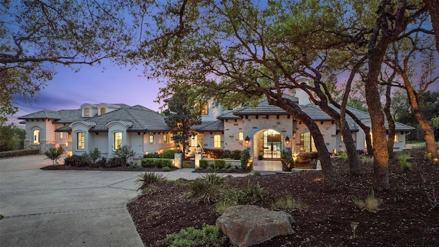 212 Bella Cima Dr, Austin, TX 78734 - french country home with driveway, stucco siding, and a tile roof
