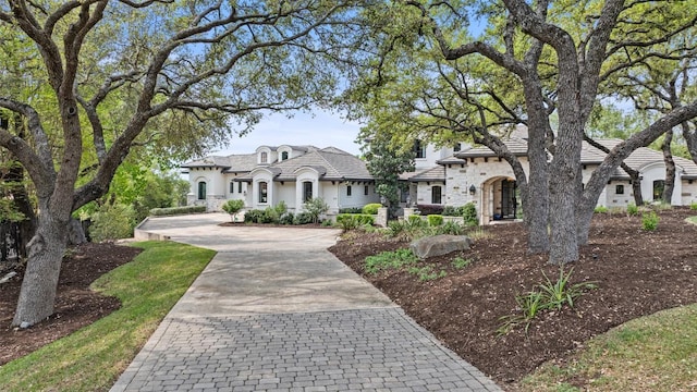 212 Bella Cima Dr, Austin, TX 78734 - french country inspired facade featuring stucco siding, driveway, and stone siding