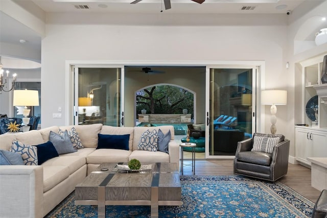 212 Bella Cima Dr, Austin, TX 78734 - living area with a ceiling fan, wood finished floors, and a chandelier