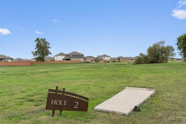 view of yard featuring a residential view and fence