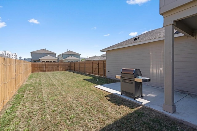 view of yard with a fenced backyard and a patio