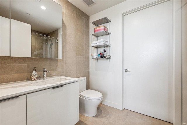 44 E Ave Unit 2509, Austin, TX 78701 - full bath with tile walls, vanity, tile patterned floors, a tile shower, and backsplash