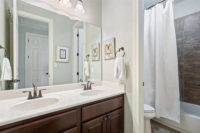 577 Shelf Rock Rd, Driftwood, TX 78619 - full bathroom featuring toilet, double vanity, and shower / bath combo