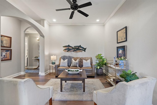 577 Shelf Rock Rd, Driftwood, TX 78619 - living area featuring arched walkways, ceiling fan, wood finished floors, crown molding, and baseboards