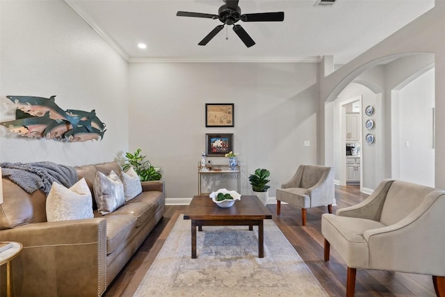 577 Shelf Rock Rd, Driftwood, TX 78619 - living room featuring arched walkways, wood finished floors, ceiling fan, ornamental molding, and baseboards