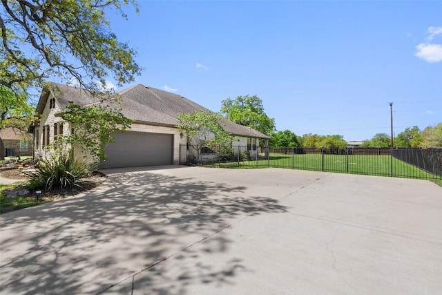 577 Shelf Rock Rd, Driftwood, TX 78619 - view of property exterior with driveway and an attached garage