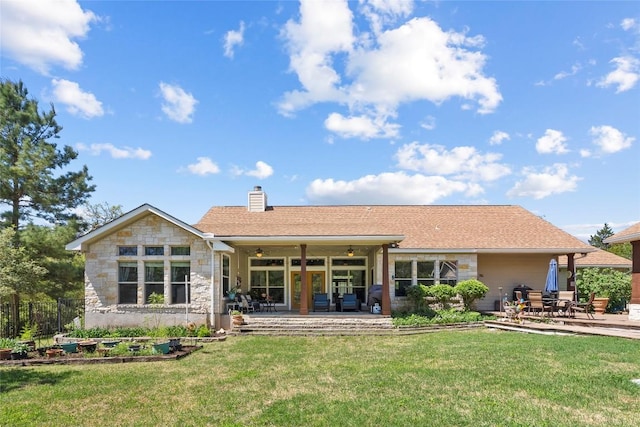 119 Maple Leaf Trl, Elgin, TX 78621 - rear view of property featuring a patio area, a yard, ceiling fan, and a chimney