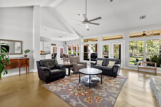 119 Maple Leaf Trl, Elgin, TX 78621 - living room featuring concrete flooring, a ceiling fan, french doors, high vaulted ceiling, and beam ceiling