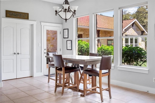 119 Maple Leaf Trl, Elgin, TX 78621 - dining room with plenty of natural light, a chandelier, and light tile patterned floors