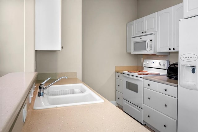 119 Maple Leaf Trl, Elgin, TX 78621 - kitchen featuring white appliances, white cabinetry, and light countertops