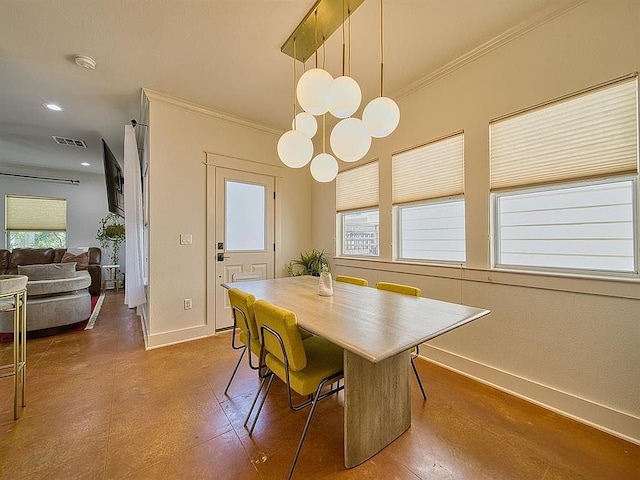 dining room featuring crown molding, visible vents, and baseboards