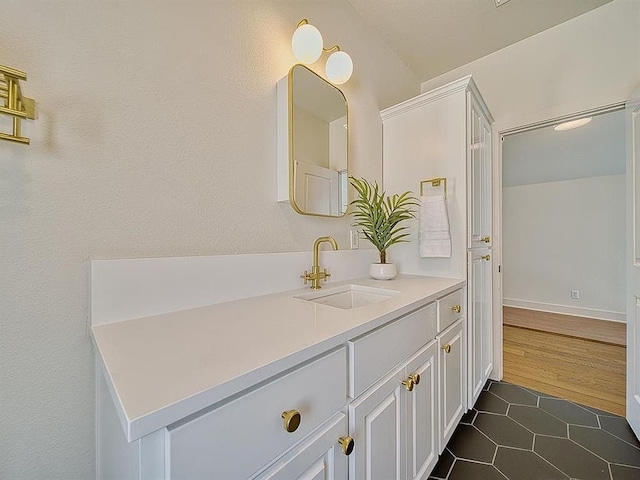 bathroom featuring tile patterned floors and vanity