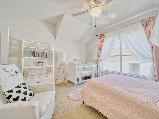 carpeted bedroom featuring baseboards, a ceiling fan, and lofted ceiling