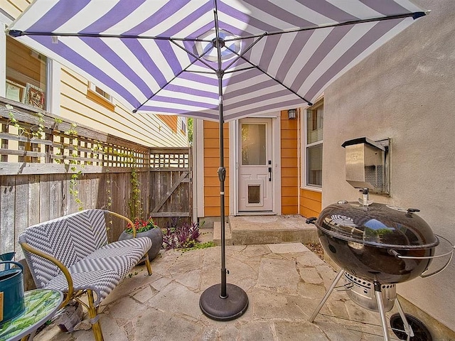 view of patio / terrace with fence