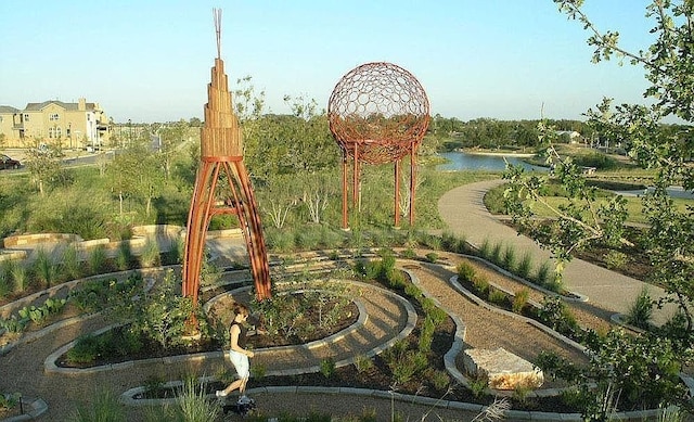 view of jungle gym featuring a water view
