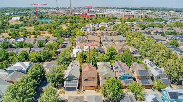 drone / aerial view with a residential view and a water view