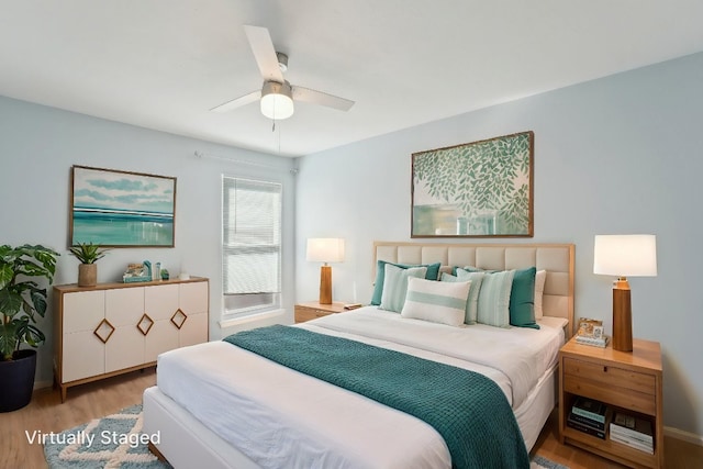 bedroom with a ceiling fan and wood finished floors