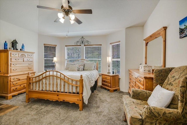 bedroom with a ceiling fan and light colored carpet