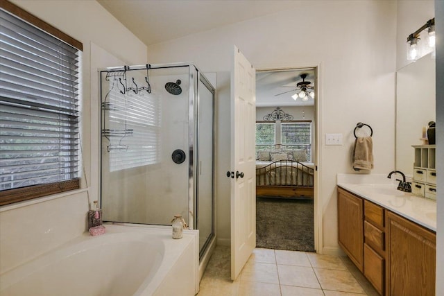 7404 Little Oak Cir, Lago Vista, TX 78645 - ensuite bathroom with ceiling fan, a stall shower, a bath, tile patterned flooring, and vanity