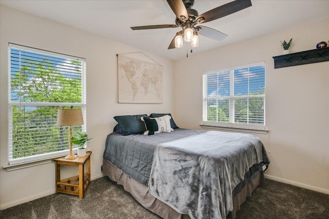 bedroom featuring carpet and multiple windows