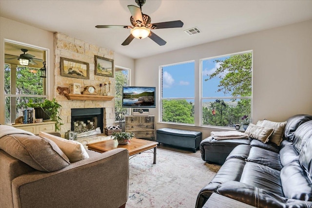 7404 Little Oak Cir, Lago Vista, TX 78645 - living area with ceiling fan, a fireplace, and wood finished floors