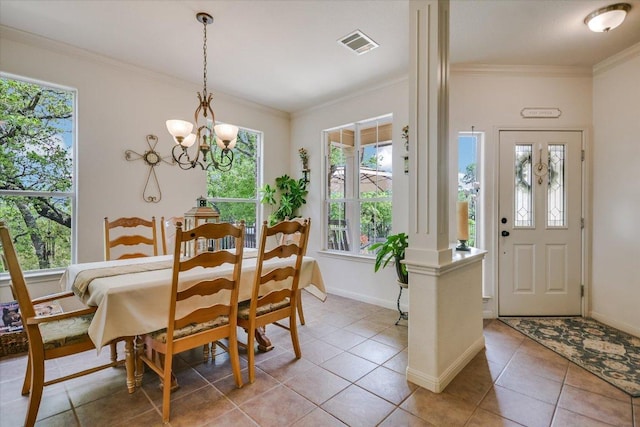 7404 Little Oak Cir, Lago Vista, TX 78645 - dining room featuring plenty of natural light, light tile patterned flooring, crown molding, and a chandelier