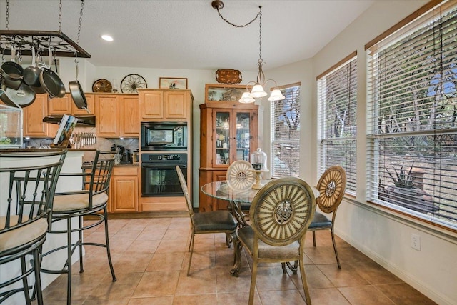 7404 Little Oak Cir, Lago Vista, TX 78645 - dining room featuring a chandelier, light tile patterned floors, and recessed lighting