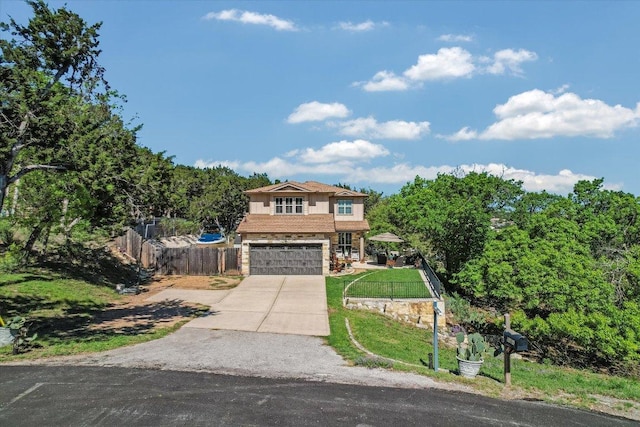7404 Little Oak Cir, Lago Vista, TX 78645 - view of front of property with concrete driveway, an attached garage, and stone siding