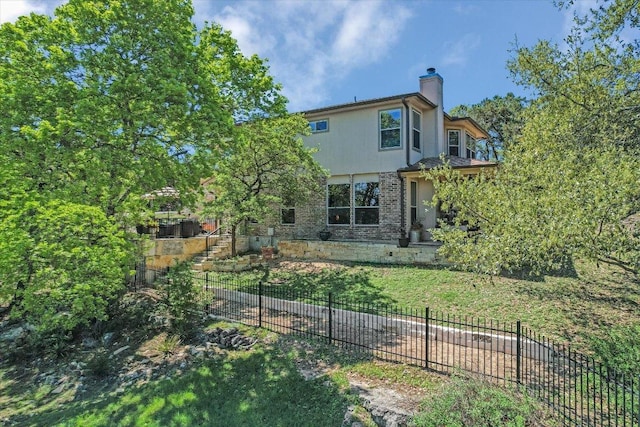 7404 Little Oak Cir, Lago Vista, TX 78645 - rear view of house featuring a chimney and brick siding