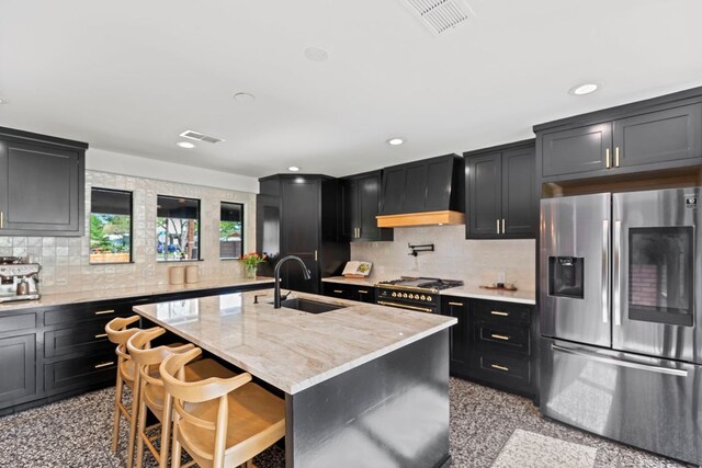 6009 Grover Ave, Austin, TX 78757 - kitchen featuring stainless steel fridge, a sink, premium range hood, granite floors, and dark cabinetry