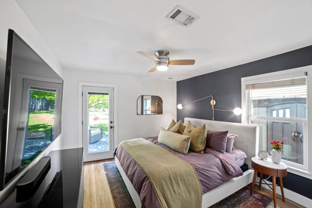 6009 Grover Ave, Austin, TX 78757 - bedroom with access to outside, light wood-style floors, and a ceiling fan