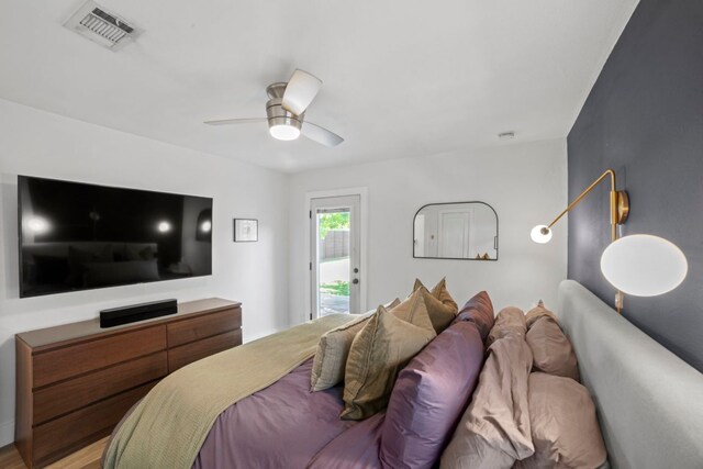 6009 Grover Ave, Austin, TX 78757 - bedroom with access to exterior and ceiling fan