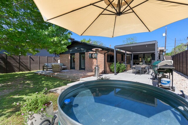 6009 Grover Ave, Austin, TX 78757 - view of swimming pool featuring a fenced backyard, grilling area, a wooden deck, a patio area, and outdoor dining space